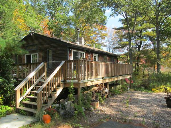 22 Henry Road Wales, MA 01081 - Photo 4 of 10 a balcony with wooden fence and trees