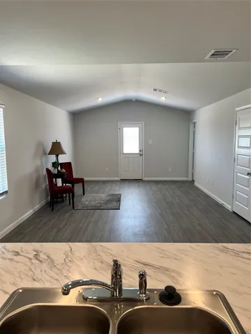 a kitchen with stainless steel appliances granite countertop a sink and a stove