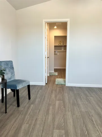a large white kitchen with a stove and a refrigerator
