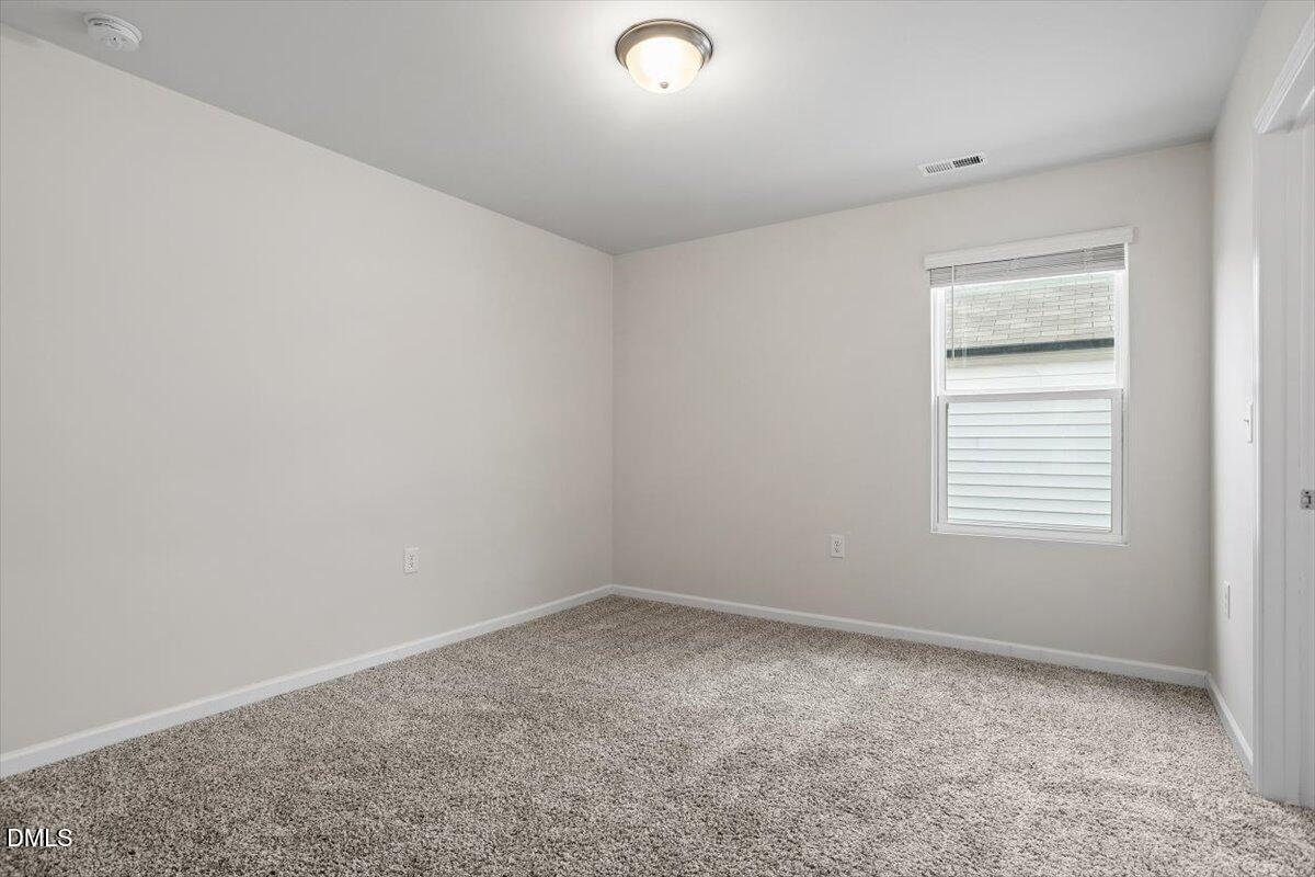 46 Coffee Tree Circle Clayton, NC 27527 - Photo 28 of 36 an empty room with a window