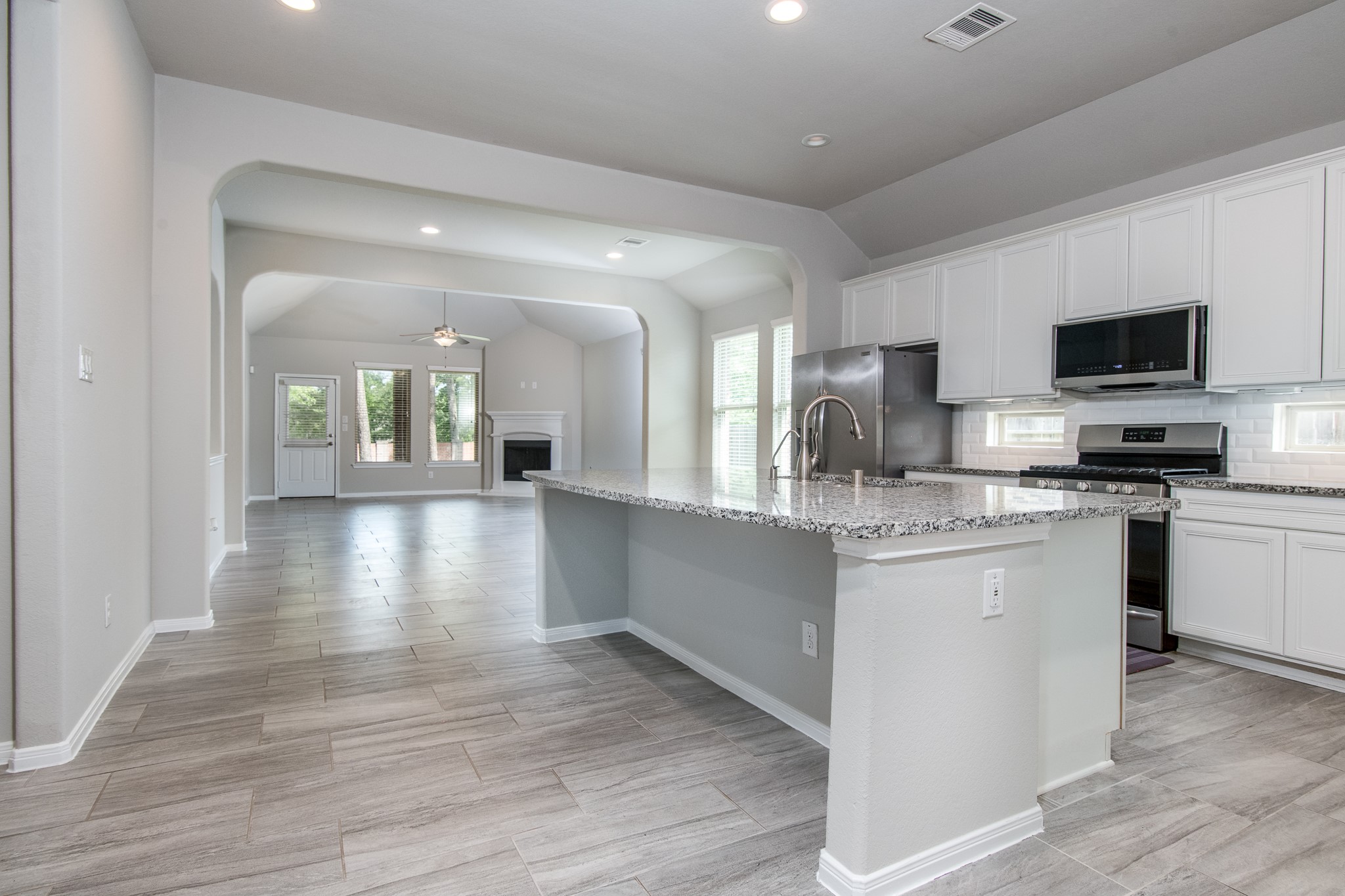 3211 Discovery Lane Conroe, TX 77301 - Photo 4 of 22 Open space from the kitchen to dining to living room