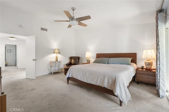 a bedroom with bed and window