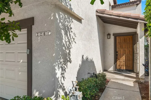a front view of a house with a garage