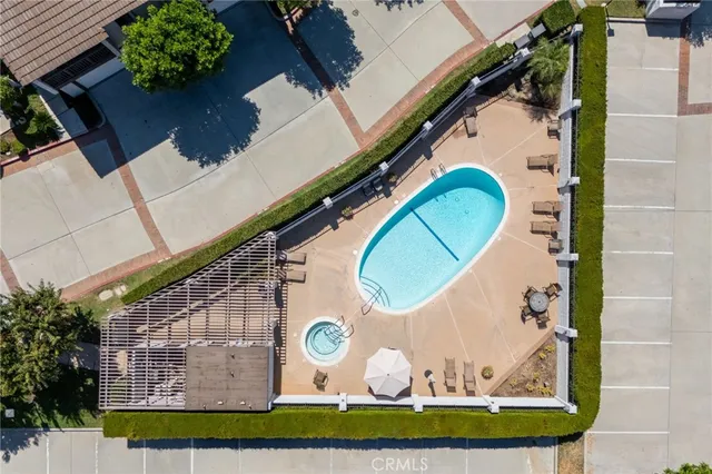 an aerial view of a houses with a yard