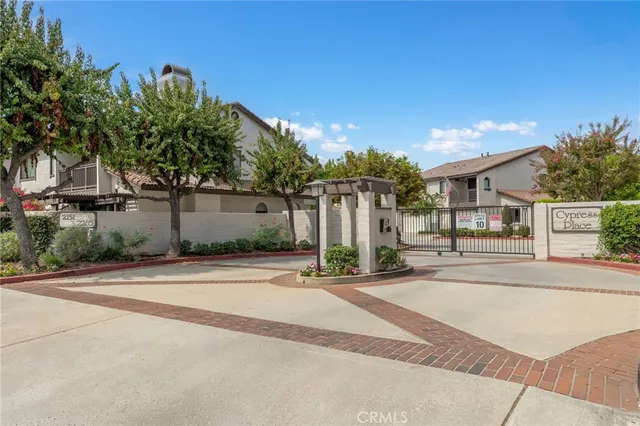 an aerial view of multiple houses with yard