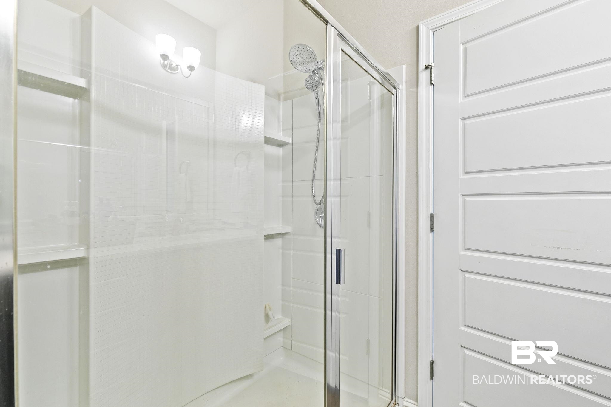 6867 Spaniel Drive, Unit B Daphne, AL 36527 - Photo 18 of 36 Bathroom featuring a shower with shower door
