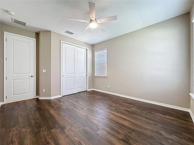 a living room with furniture large window and a fireplace