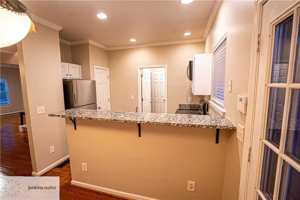 1188 Ira Street Southwest Atlanta, GA 30310 - Photo 11 of 33 a view of a kitchen with a sink and refrigerator