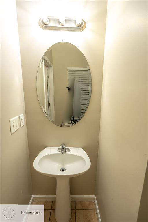 1188 Ira Street Southwest Atlanta, GA 30310 - Photo 15 of 33 a bathroom with a sink and mirror