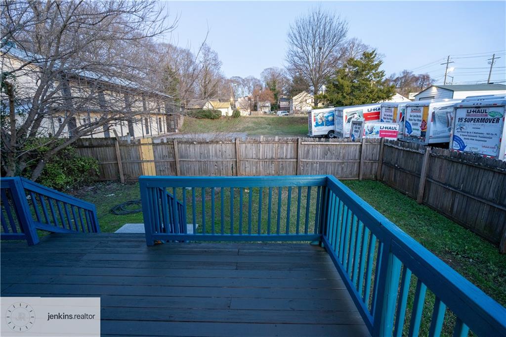 1188 Ira Street Southwest Atlanta, GA 30310 - Photo 17 of 33 a view of deck with wooden fence and trees