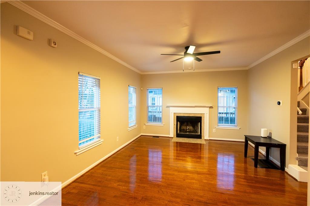 1188 Ira Street Southwest Atlanta, GA 30310 - Photo 2 of 33 a living room with fireplace furniture and a wooden floor