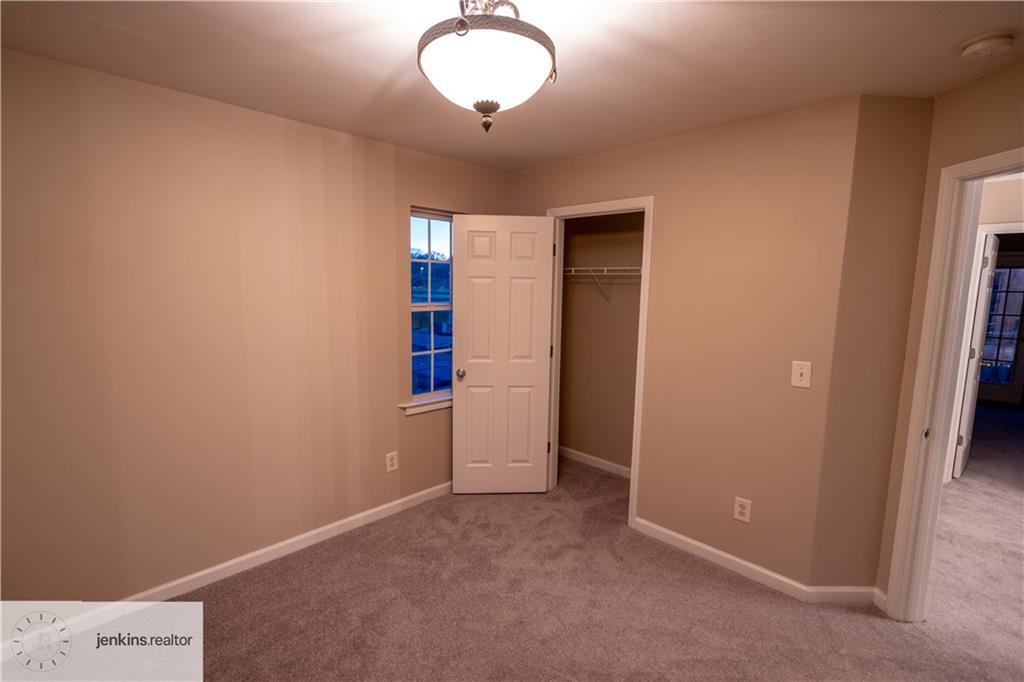 1188 Ira Street Southwest Atlanta, GA 30310 - Photo 21 of 33 an empty room with closet and windows