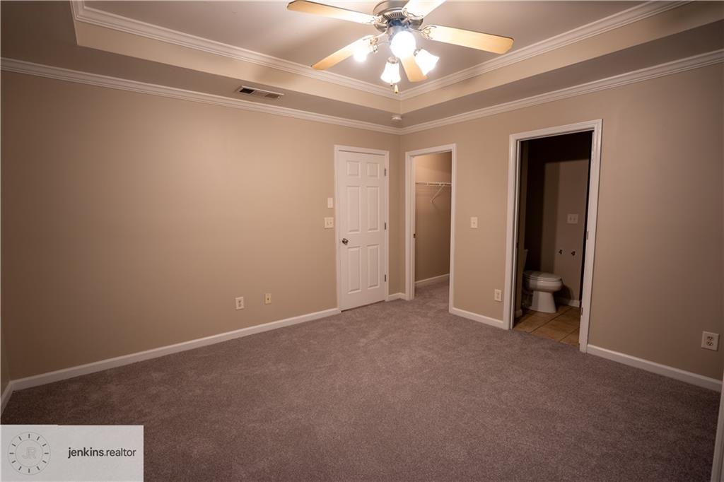 1188 Ira Street Southwest Atlanta, GA 30310 - Photo 29 of 33 an empty room with a ceiling fan and a window