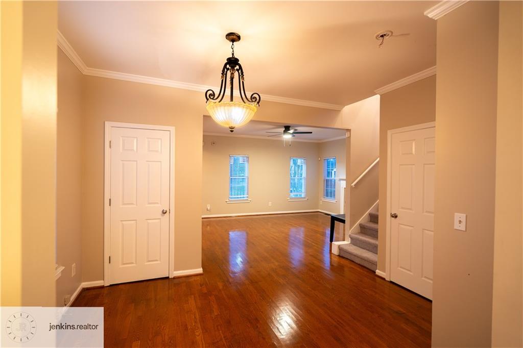 1188 Ira Street Southwest Atlanta, GA 30310 - Photo 3 of 33 a view of a hallway with wooden floor and staircase