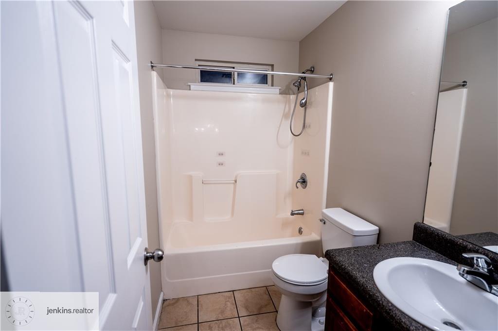 1188 Ira Street Southwest Atlanta, GA 30310 - Photo 32 of 33 a bathroom with a sink toilet tub and shower