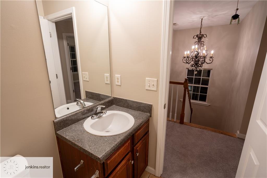 1188 Ira Street Southwest Atlanta, GA 30310 - Photo 33 of 33 a bathroom with a sink and a mirror