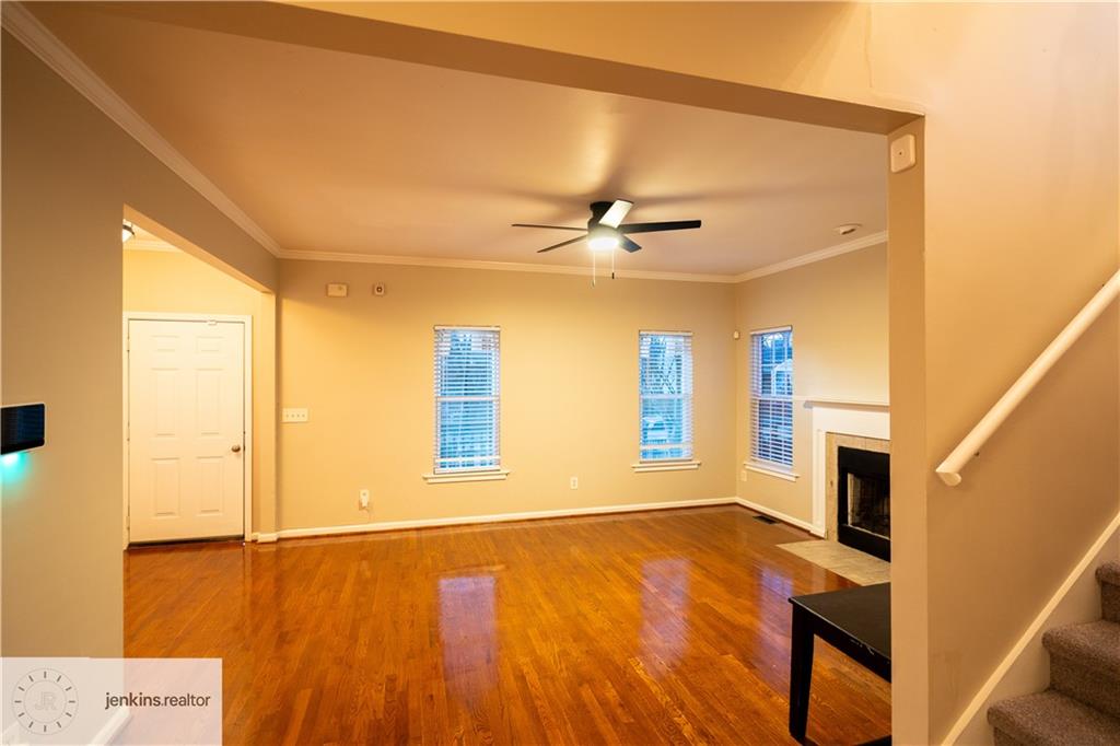 1188 Ira Street Southwest Atlanta, GA 30310 - Photo 6 of 33 a view of an empty room with a window and wooden floor