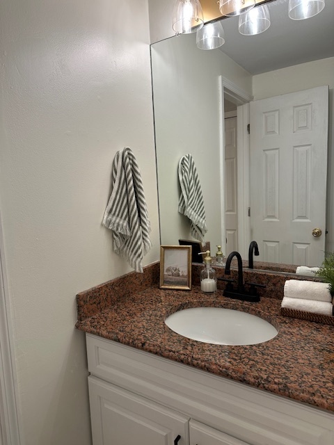 100 Rising Trail Drive, Unit 100 Middletown, CT 06457 - Photo 15 of 33 a bathroom with a granite countertop sink and a mirror
