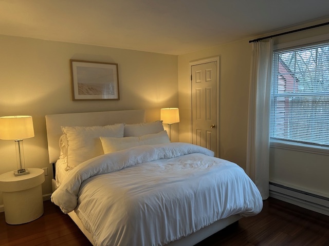 100 Rising Trail Drive, Unit 100 Middletown, CT 06457 - Photo 17 of 33 a bedroom with a bed and lamp