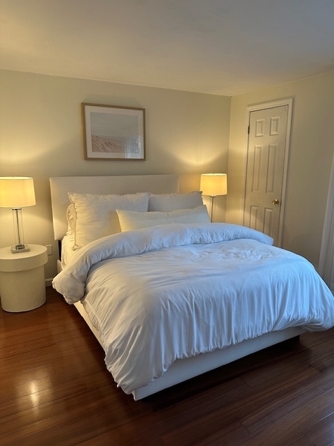 100 Rising Trail Drive, Unit 100 Middletown, CT 06457 - Photo 18 of 33 a bedroom with a bed and lamp