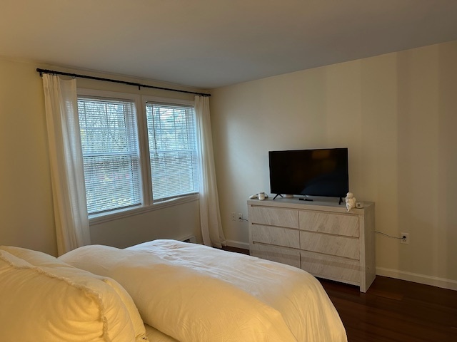 100 Rising Trail Drive, Unit 100 Middletown, CT 06457 - Photo 19 of 33 a bedroom with a bed and a flat screen tv