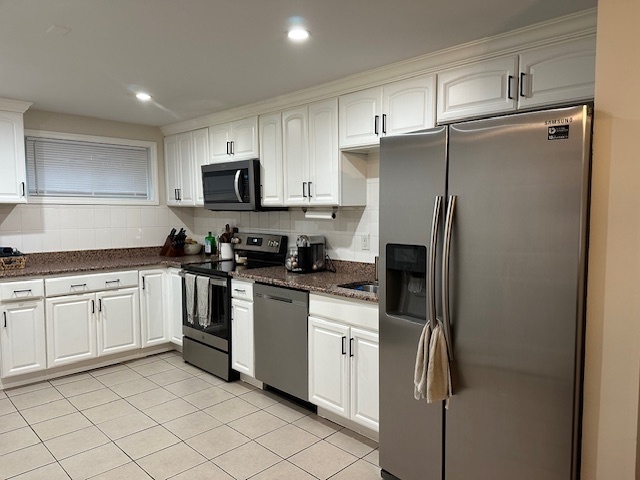 100 Rising Trail Drive, Unit 100 Middletown, CT 06457 - Photo 2 of 33 a kitchen with stainless steel appliances granite countertop a refrigerator a stove a sink and a microwave