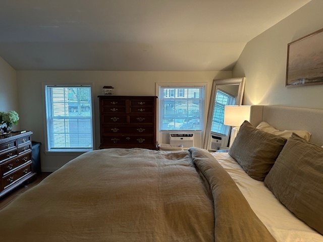 100 Rising Trail Drive, Unit 100 Middletown, CT 06457 - Photo 23 of 33 a large bed sitting in a bedroom next to a window and dresser