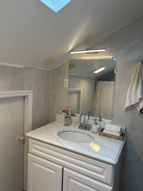 100 Rising Trail Drive, Unit 100 Middletown, CT 06457 - Photo 28 of 33 a bathroom with a sink and a mirror