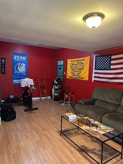 100 Rising Trail Drive, Unit 100 Middletown, CT 06457 - Photo 30 of 33 a room with furniture gym equipment and a chandelier