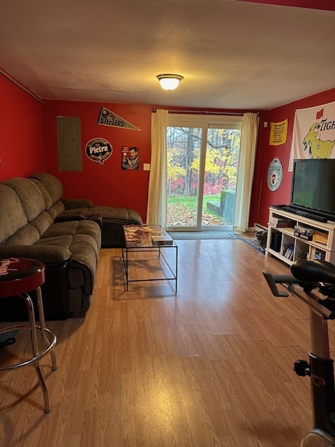 100 Rising Trail Drive, Unit 100 Middletown, CT 06457 - Photo 31 of 33 a living room with furniture and a flat screen tv