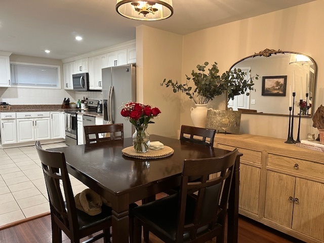 100 Rising Trail Drive, Unit 100 Middletown, CT 06457 - Photo 4 of 33 a kitchen with a dining table and chairs