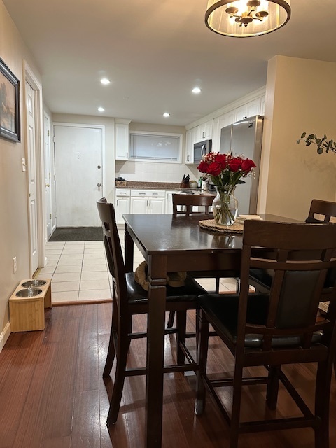 100 Rising Trail Drive, Unit 100 Middletown, CT 06457 - Photo 5 of 33 a view of a dining room with furniture and wooden floor