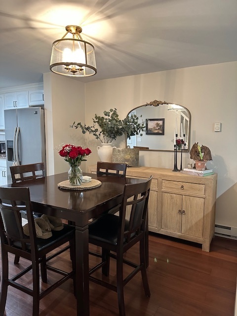 100 Rising Trail Drive, Unit 100 Middletown, CT 06457 - Photo 6 of 33 a view of a dining room with furniture and wooden floor