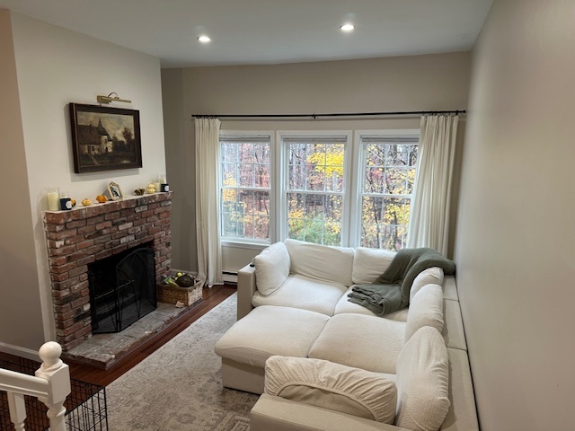 100 Rising Trail Drive, Unit 100 Middletown, CT 06457 - Photo 7 of 33 a living room with furniture a flat screen tv and a fireplace