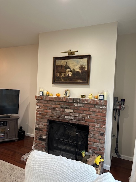 100 Rising Trail Drive, Unit 100 Middletown, CT 06457 - Photo 8 of 33 a living room with furniture a flat screen tv and a fireplace