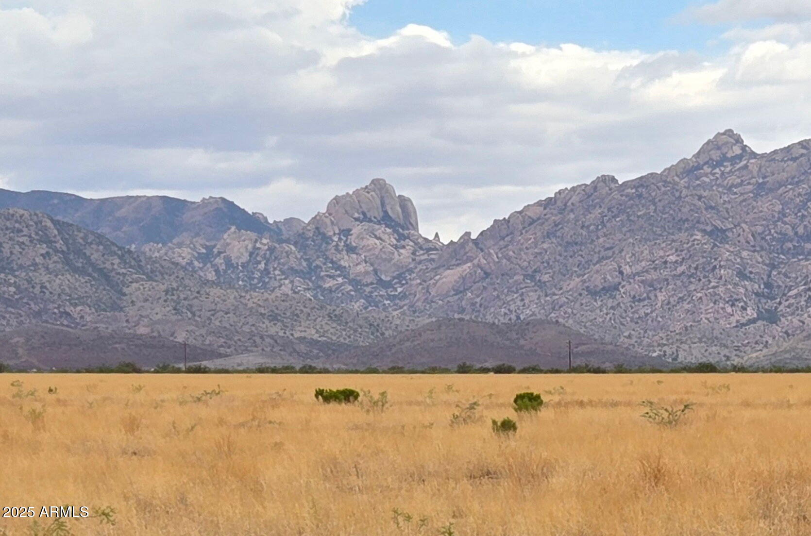 a view of an outdoor space and mountains