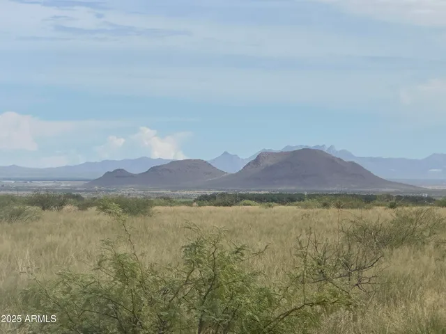 a view of an ocean and a mountain