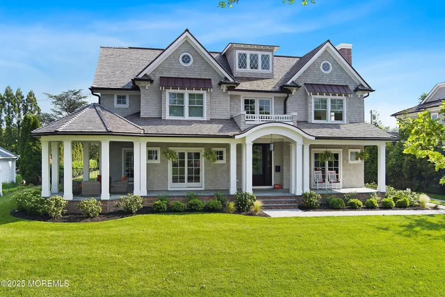 a view of a house with pool and chairs
