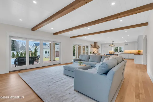 a bathroom with a granite countertop toilet a sink and a shower