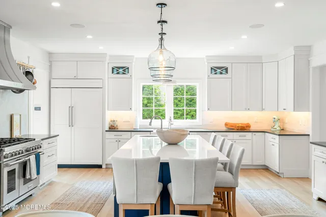 a kitchen with a table and chairs in it