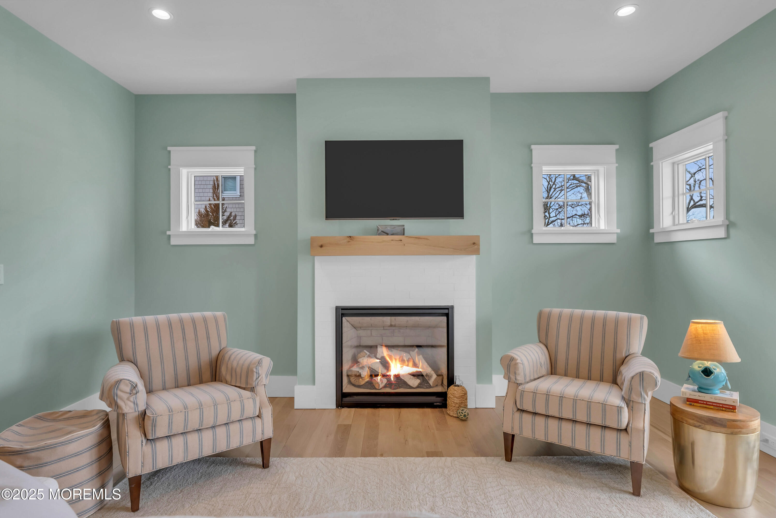 205 Morris Avenue Spring Lake, NJ 07762 - Photo 25 of 105 a living room with furniture and a fireplace