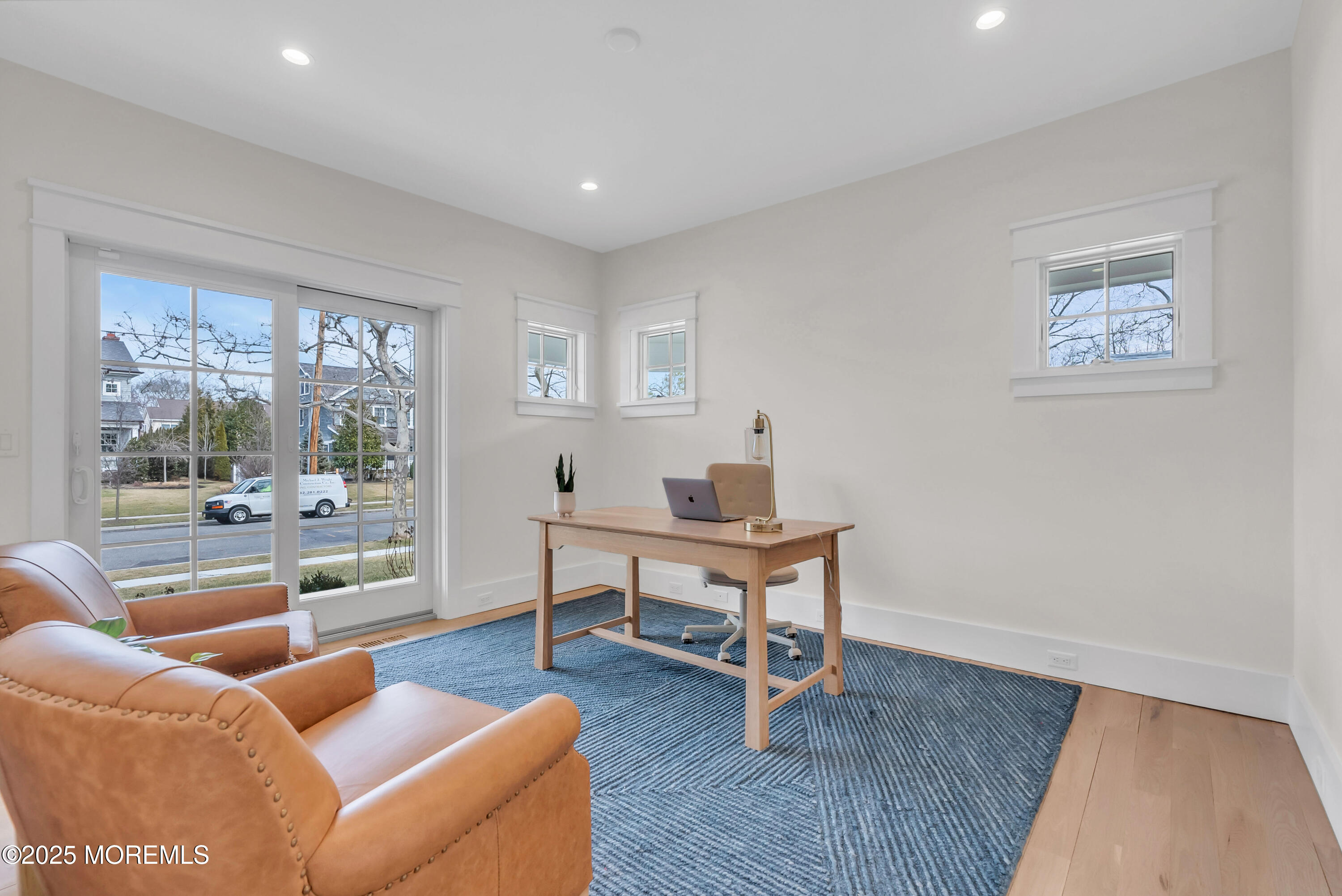 205 Morris Avenue Spring Lake, NJ 07762 - Photo 27 of 105 a living room with furniture a wooden floor and a large window