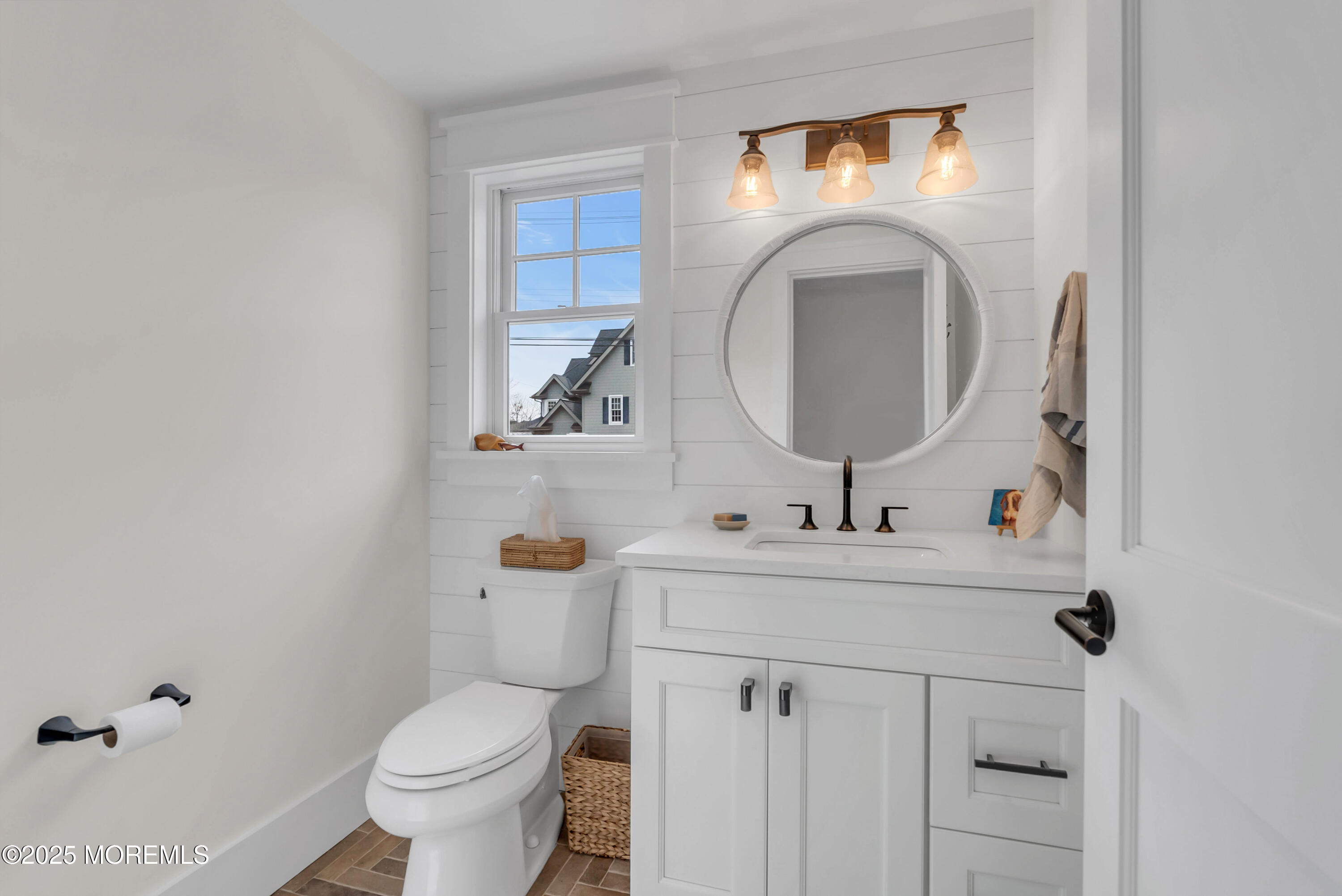 205 Morris Avenue Spring Lake, NJ 07762 - Photo 29 of 105 a bathroom with a sink mirror and toilet