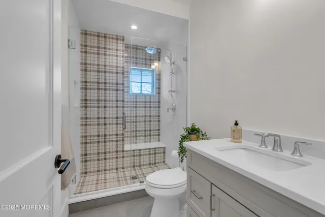 a living room with a fireplace and a flat screen tv