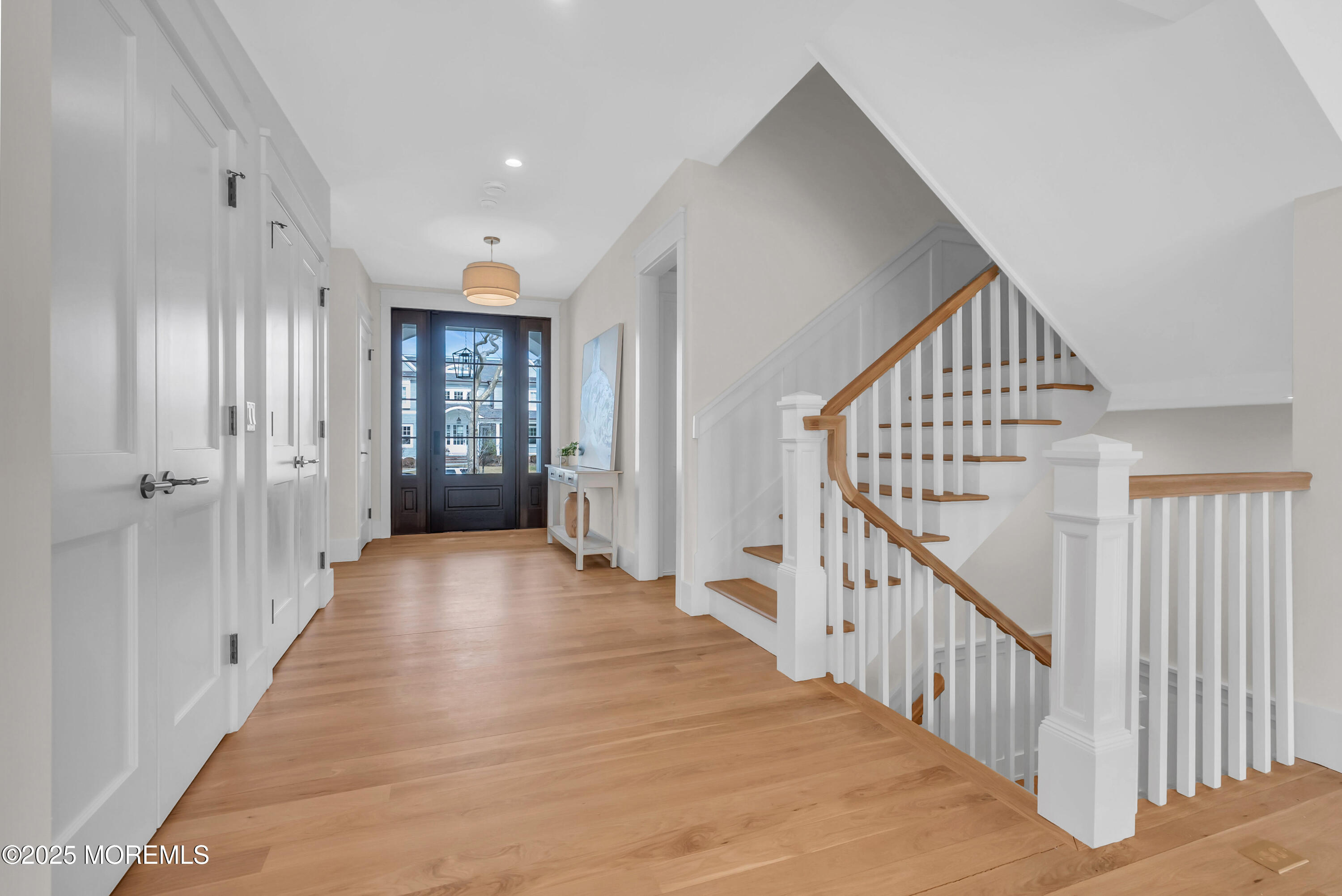 205 Morris Avenue Spring Lake, NJ 07762 - Photo 31 of 105 a view of a hallway with wooden floor and entryway