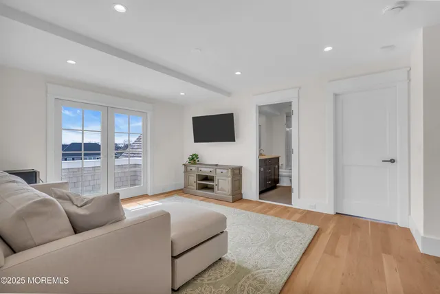 an aerial view of residential houses with city view