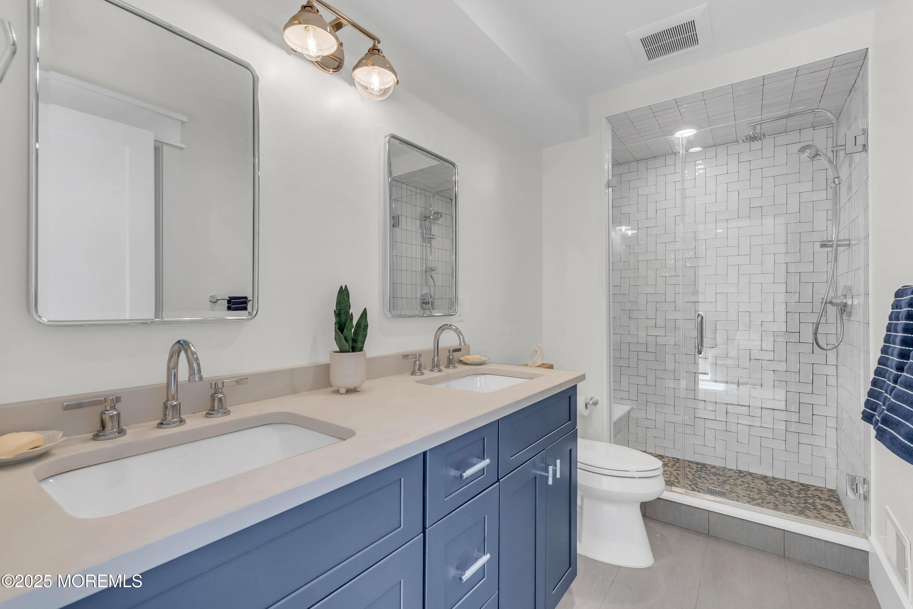 205 Morris Avenue Spring Lake, NJ 07762 - Photo 48 of 105 a bathroom with a double vanity sink toilet and shower