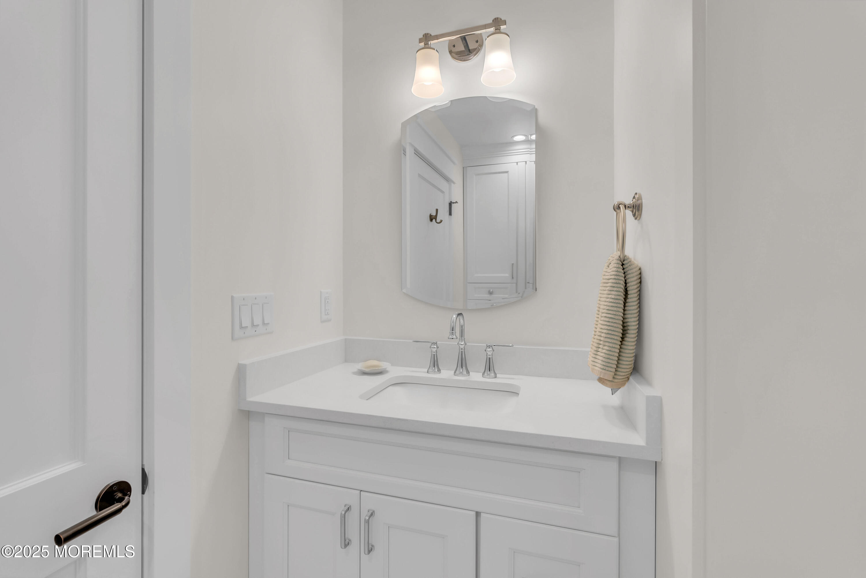 205 Morris Avenue Spring Lake, NJ 07762 - Photo 51 of 105 a bathroom with a double vanity sink and a mirror
