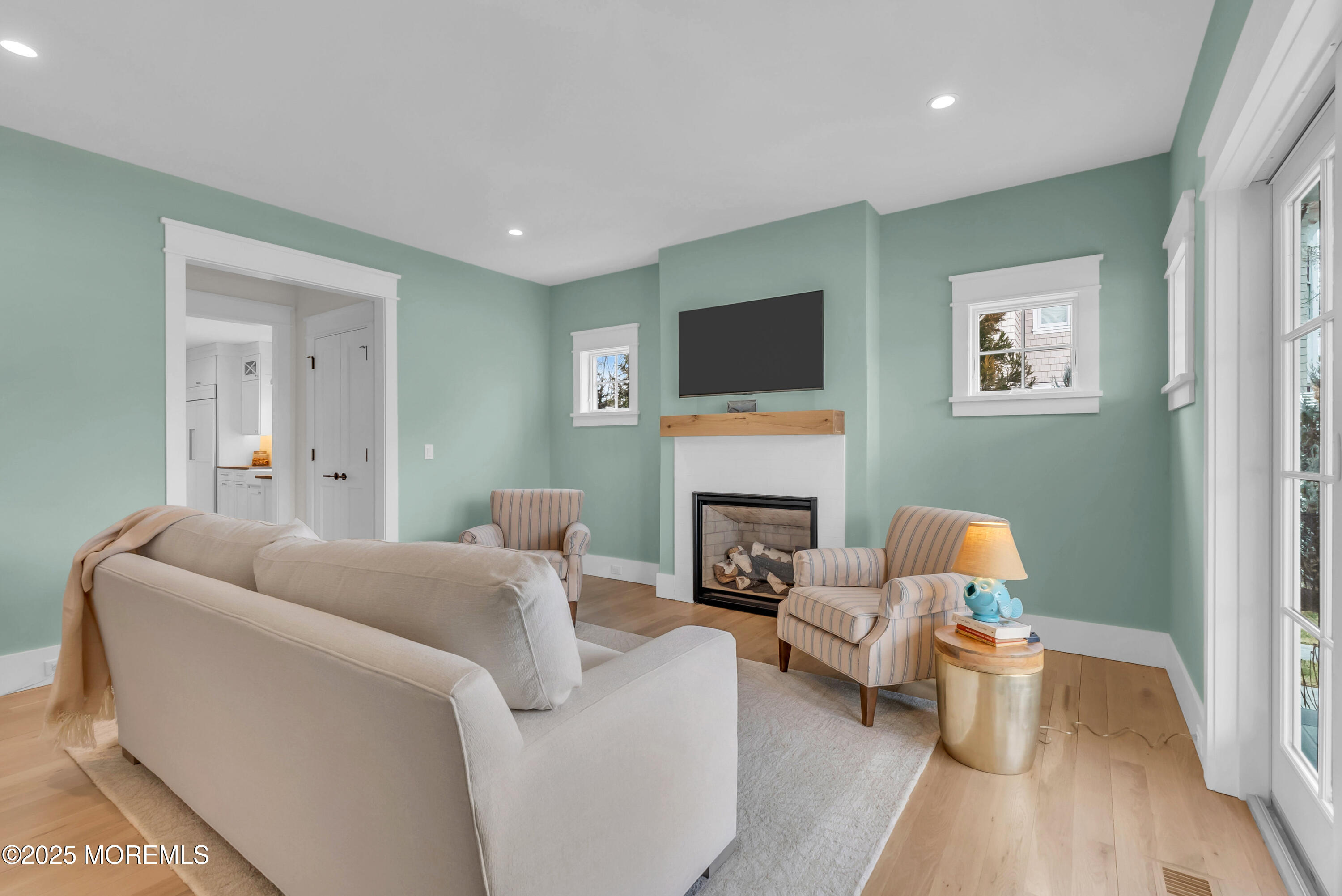 205 Morris Avenue Spring Lake, NJ 07762 - Photo 66 of 105 a living room with furniture and a fireplace