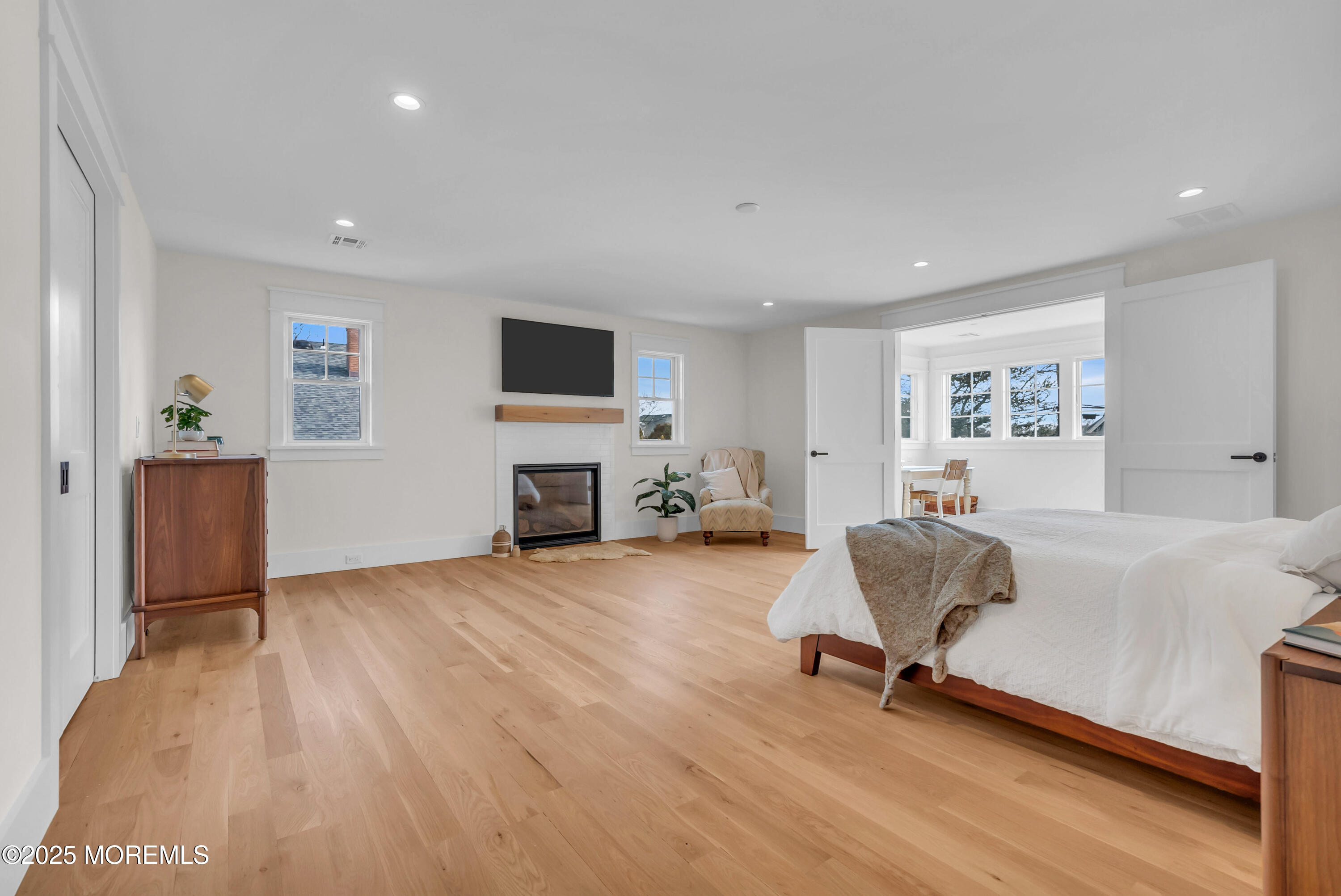 205 Morris Avenue Spring Lake, NJ 07762 - Photo 69 of 105 a living room with furniture and a flat screen tv